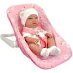 Žaislinis kūdikis ir rožinė nešioklė