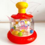 Besisukanti karuselė vaikams "Arkliukai", raudona