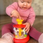 Besisukanti karuselė vaikams "Arkliukai", raudona